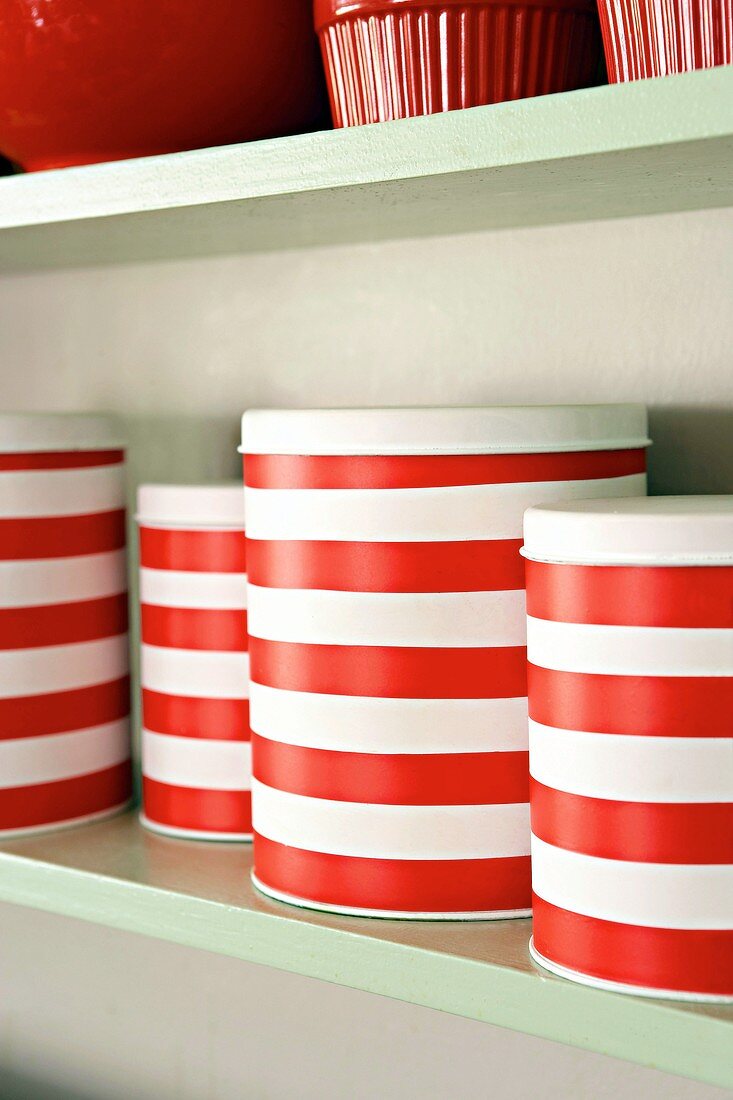 Striped containers on shelf