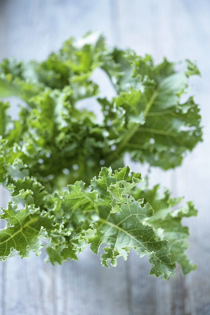 Kale on wooden background