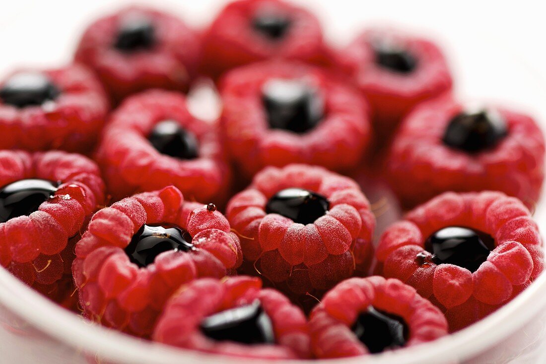 Raspberries filled with balsamic vinegar (close-up)