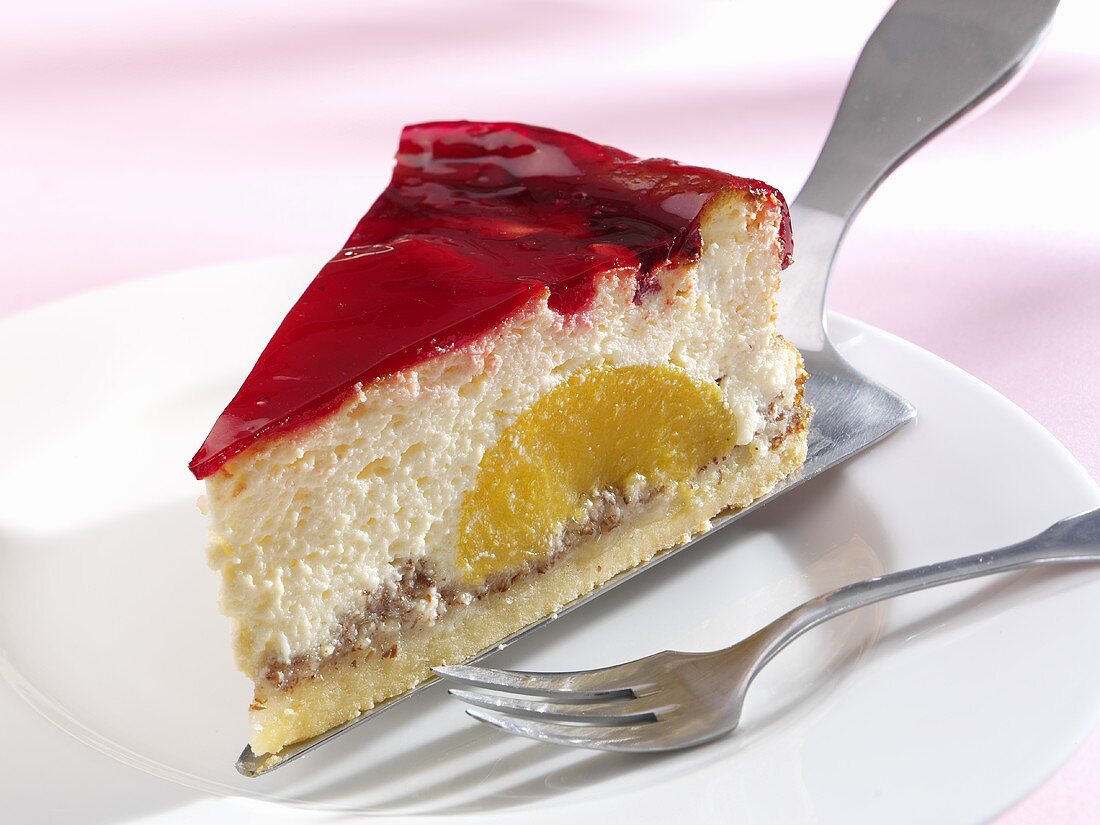 Piece of cheesecake with cassis jelly