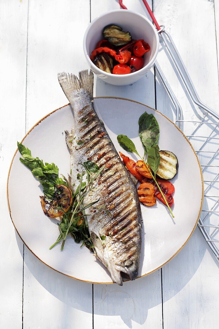 Grilled trout with herbs and vegetables