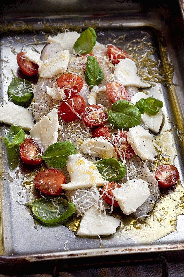 Cod with cherry tomatoes, mozzarella and basil