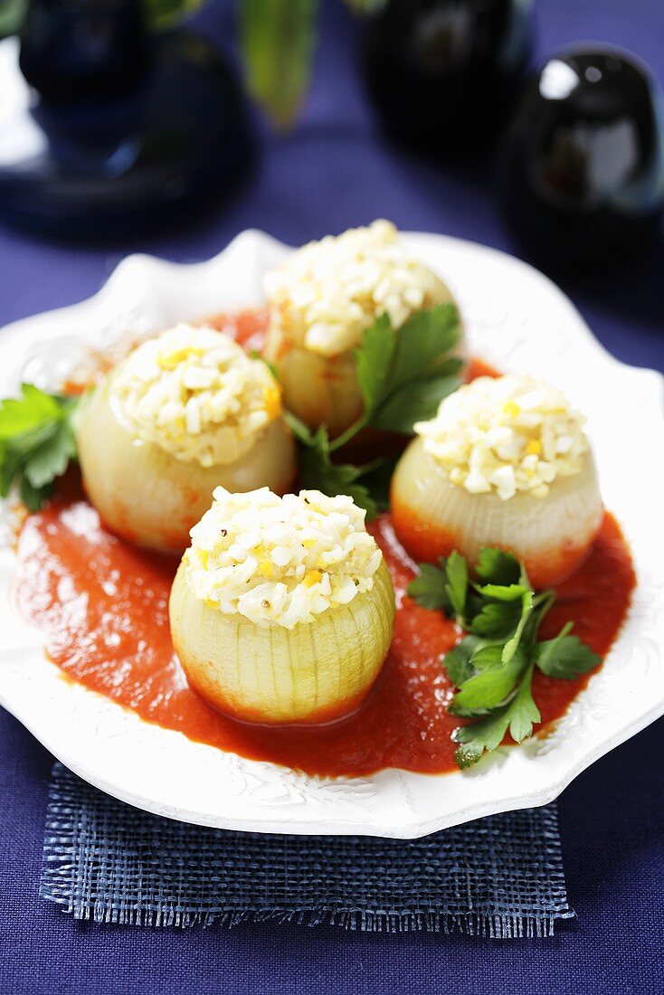 Onions with egg stuffing in tomato sauce