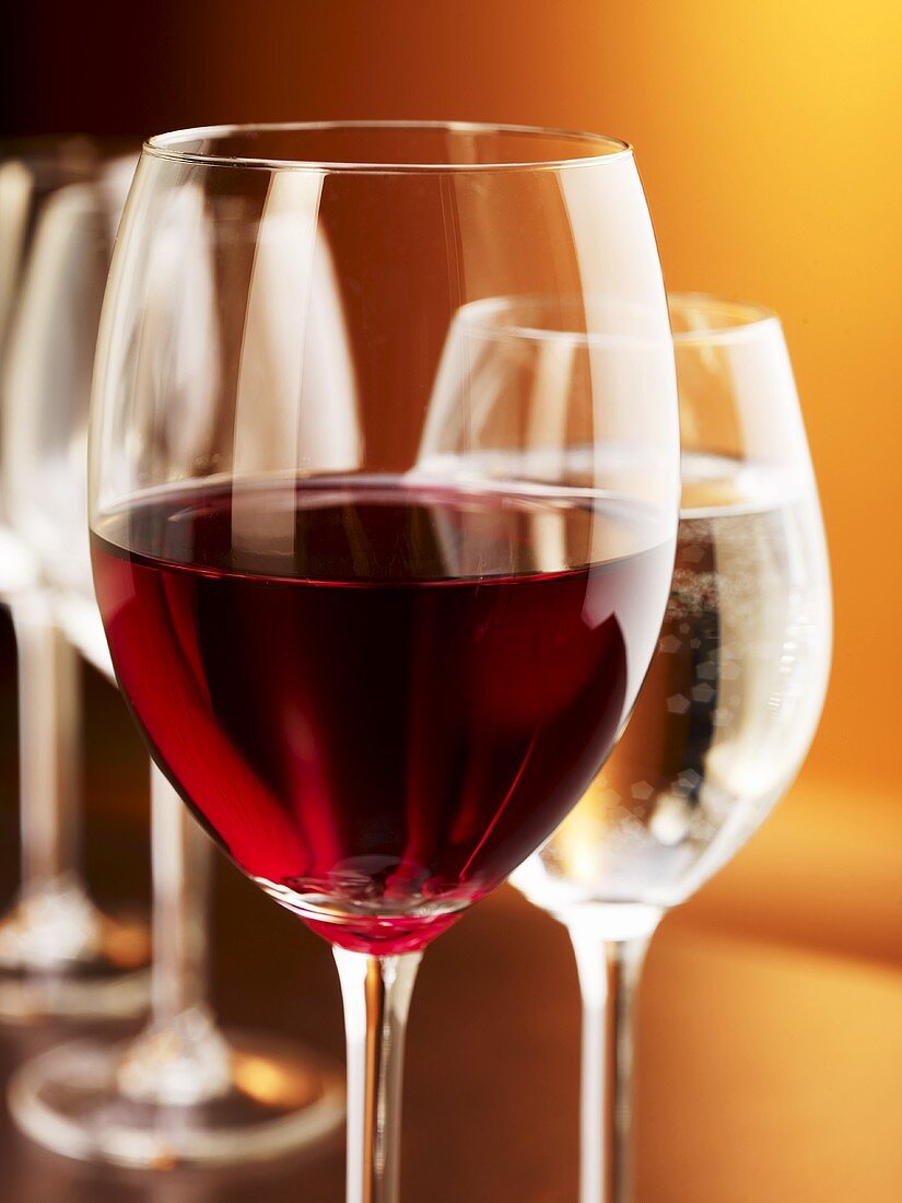 Glass of red wine and glass of water (close-up)