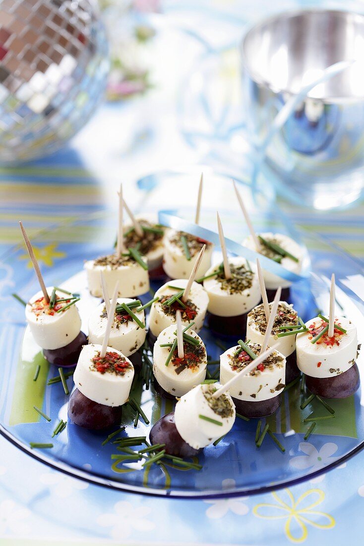 Soft cheese and grapes on cocktail sticks