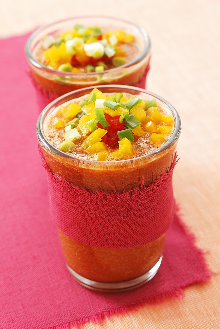 Gazpacho with diced vegetables in glasses