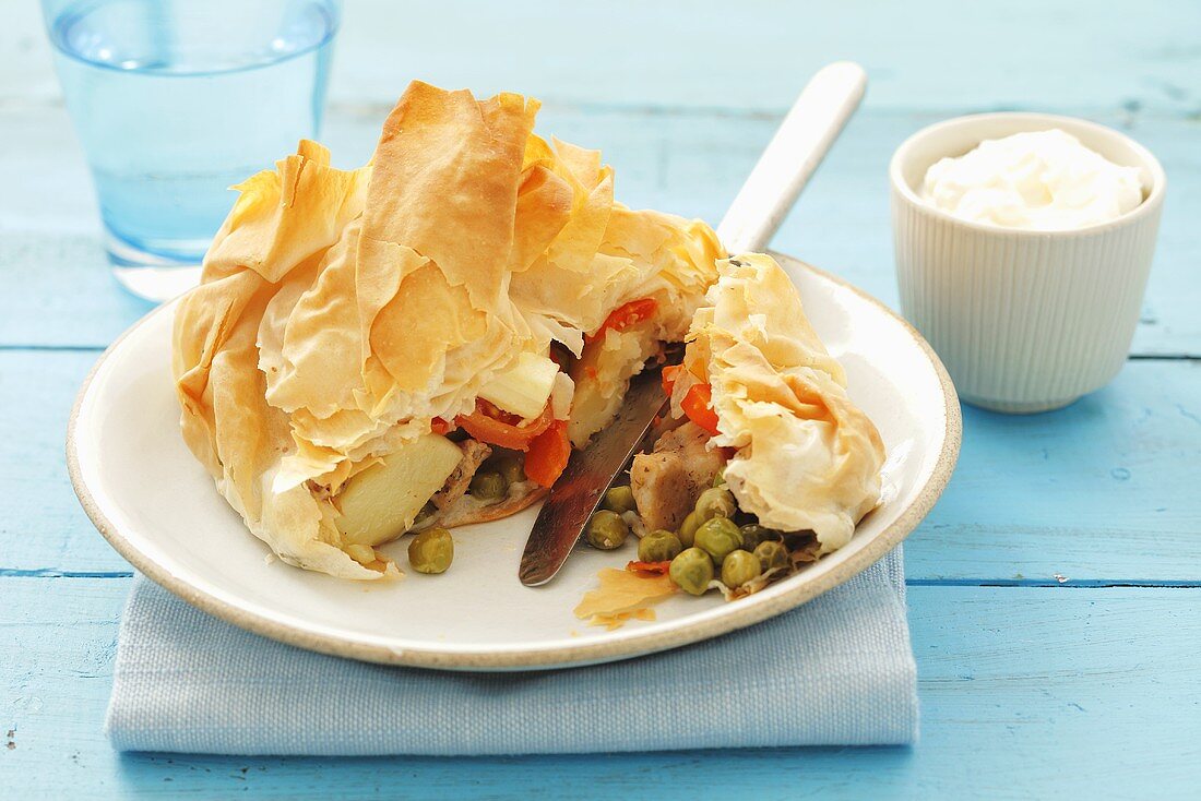 Pork with vegetables and sheep's cheese in filo pastry