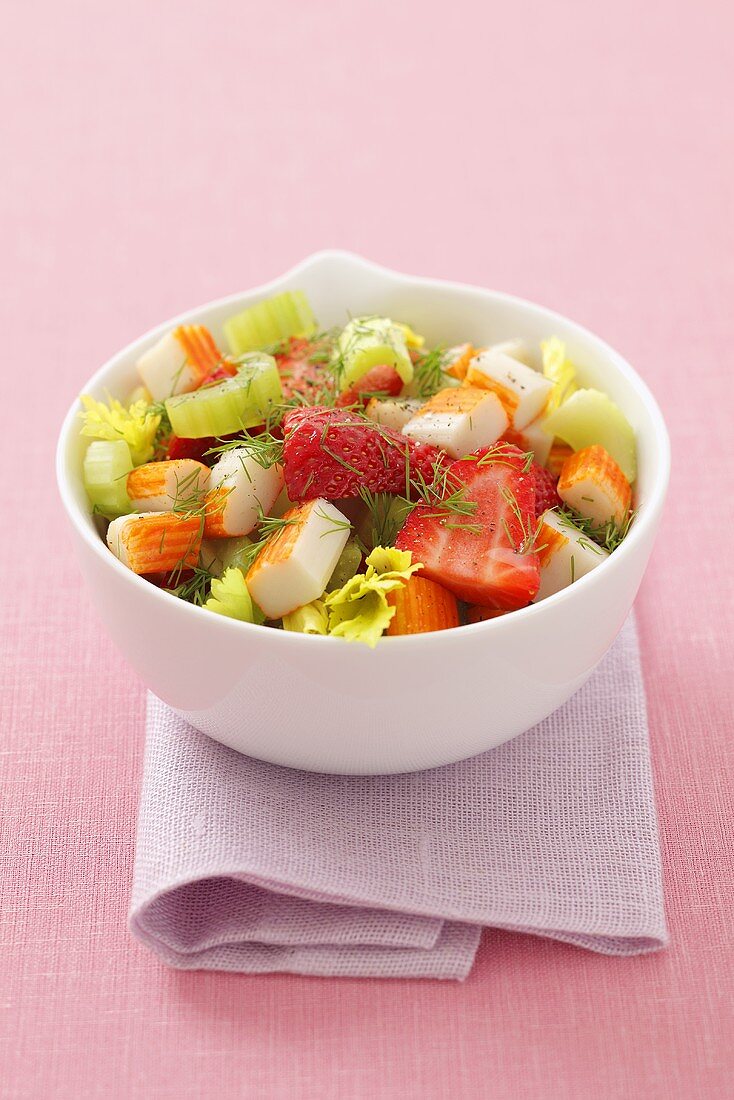 Surimi, celery and strawberry salad with dill