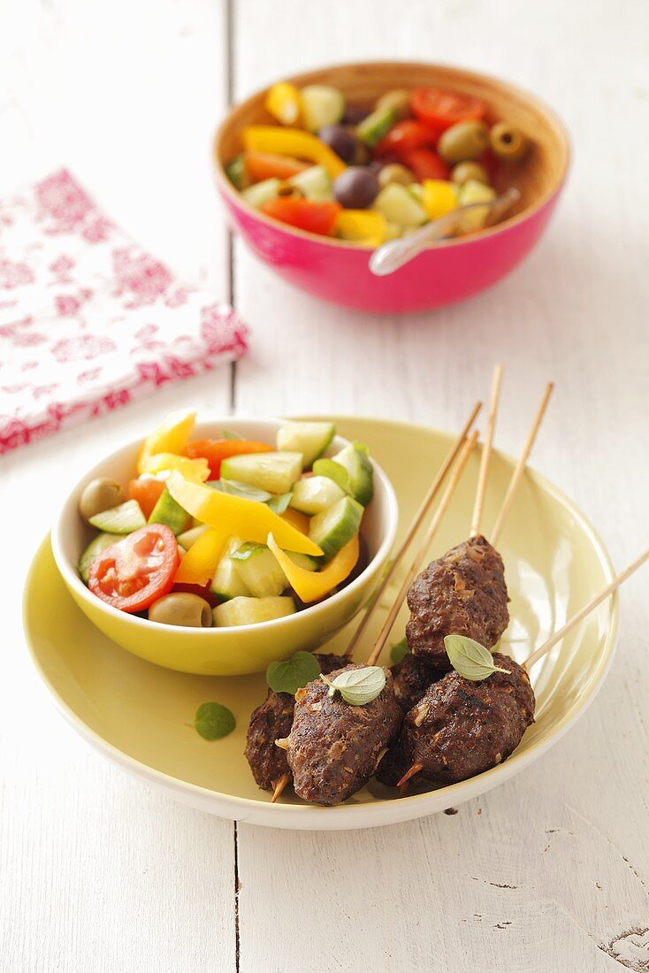 Mince skewers with salad