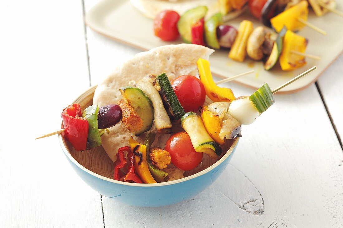 Barbecued vegetable skewers with pita bread