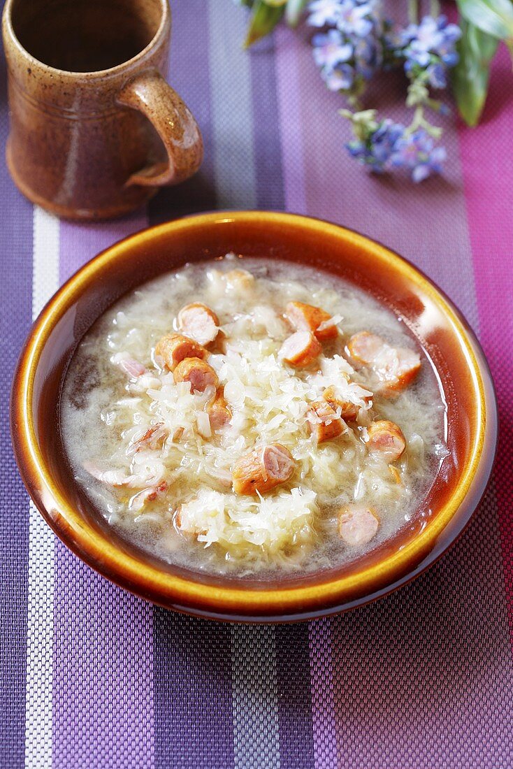 Beer soup with sauerkraut and sausage