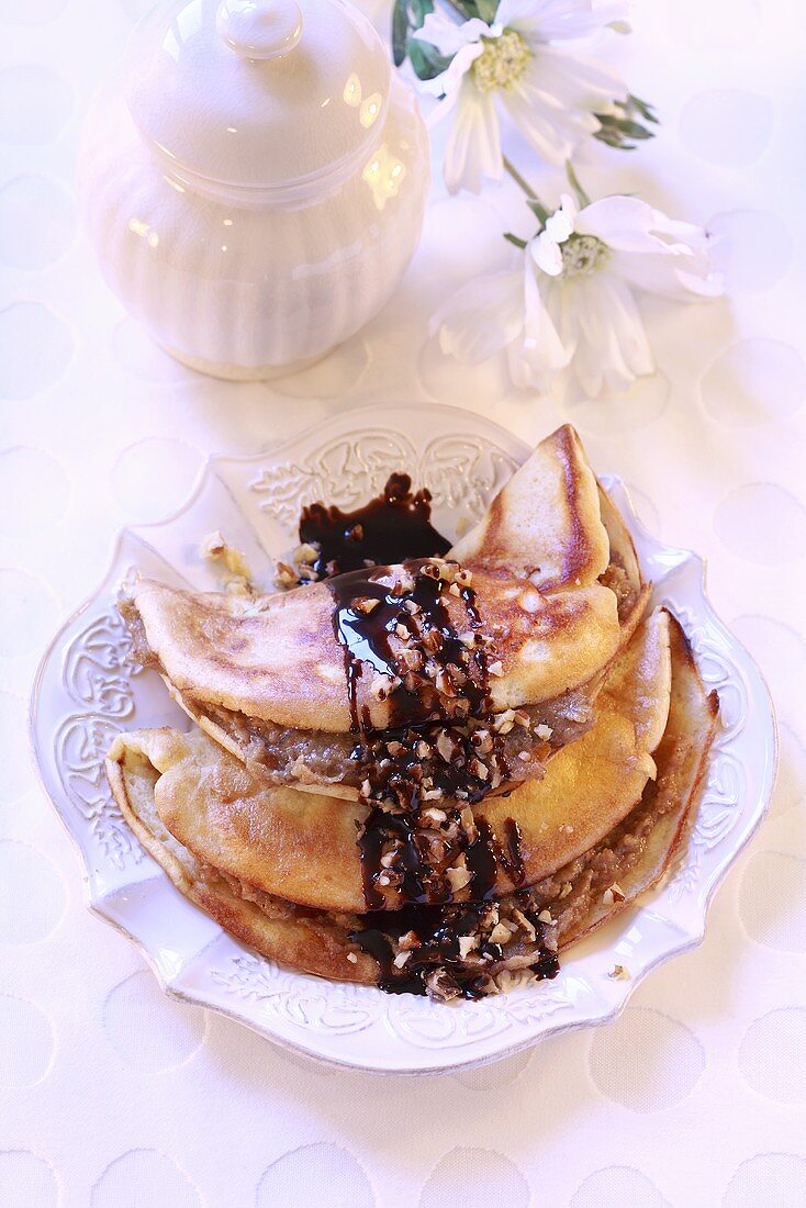 Pancakes with nut filling and chocolate sauce
