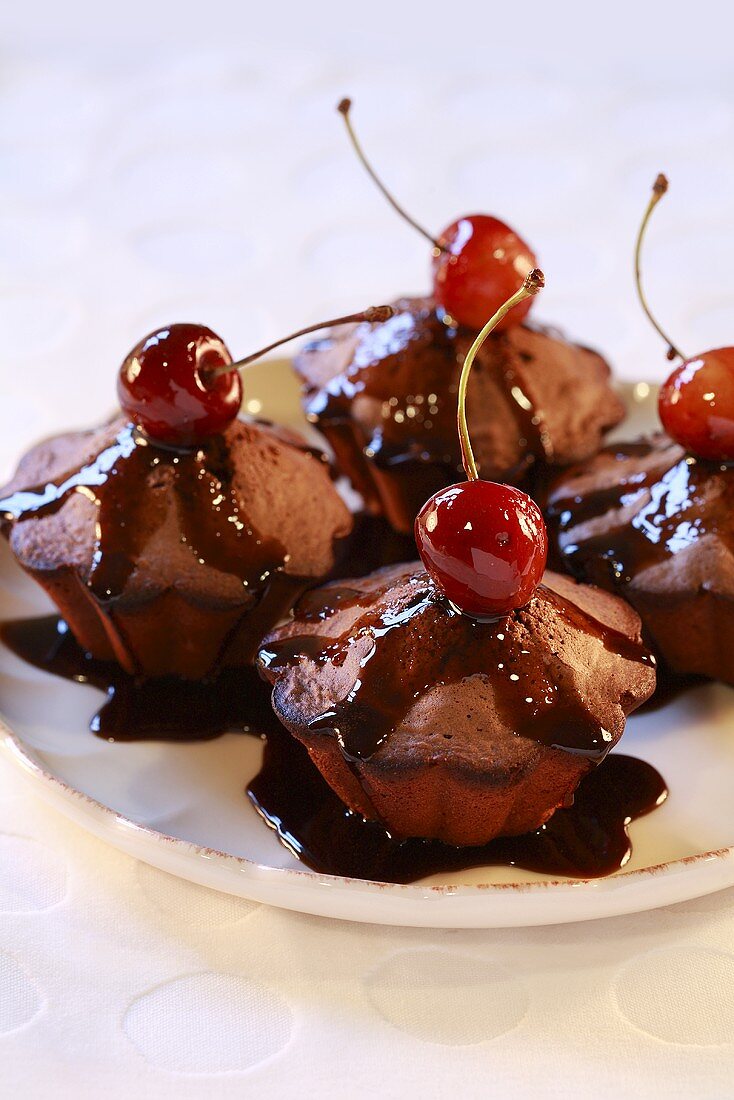 Chocolate puddings with cherries