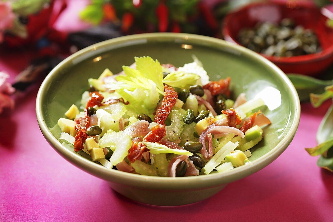 Celery salad with ham and pistachios