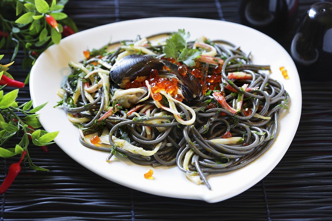 Squid ink pasta with seafood and caviar