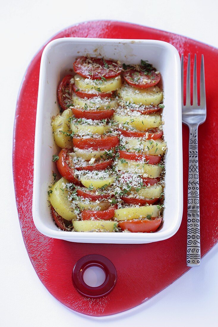 Tomato and potato bake in baking dish