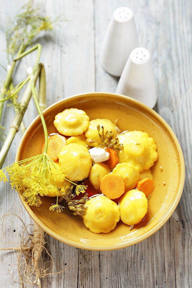 Marinated patty pan squashes with carrots and dill