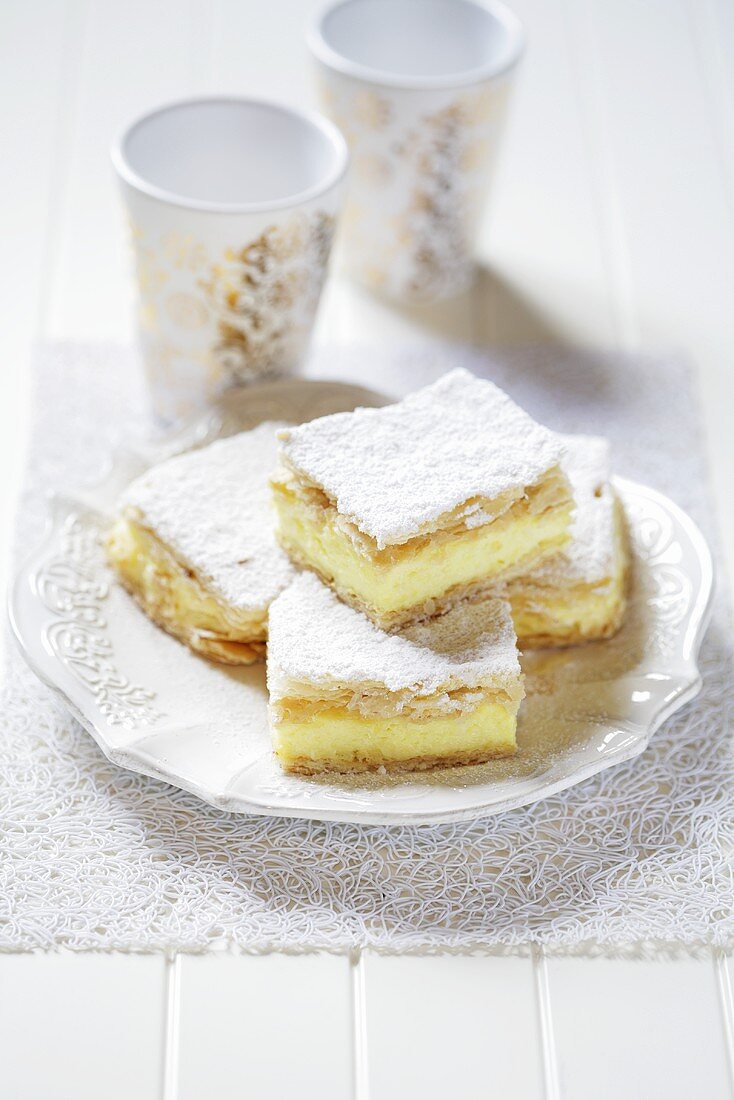 Cream slices with icing sugar