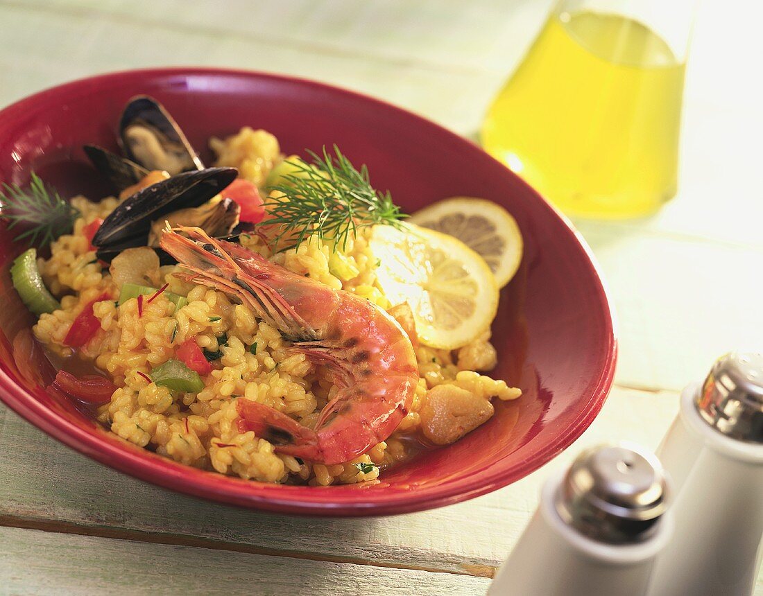 Paella with shrimp and mussels on a plate