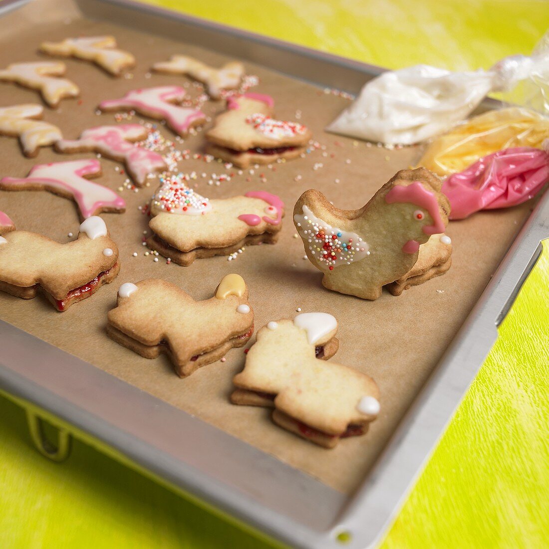 Animal-shaped Easter biscuits on a baking tray