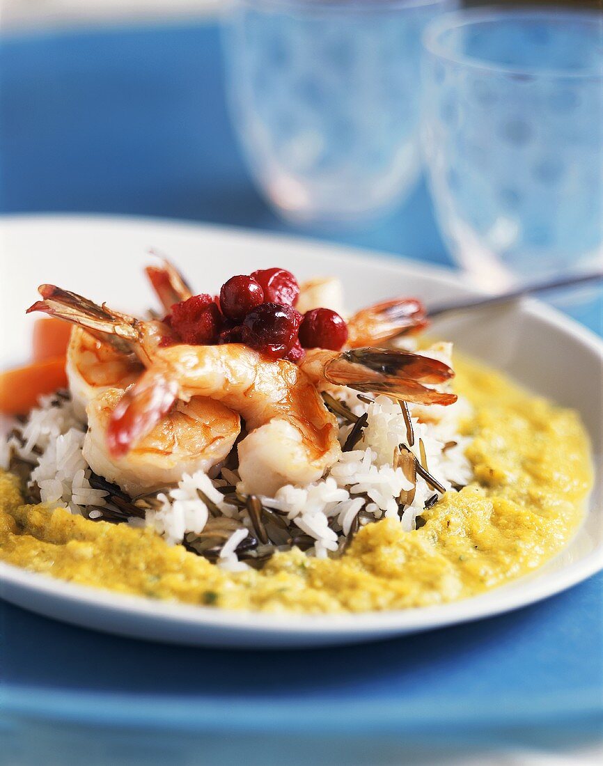 Shrimp tails on wild rice mixture with cranberries