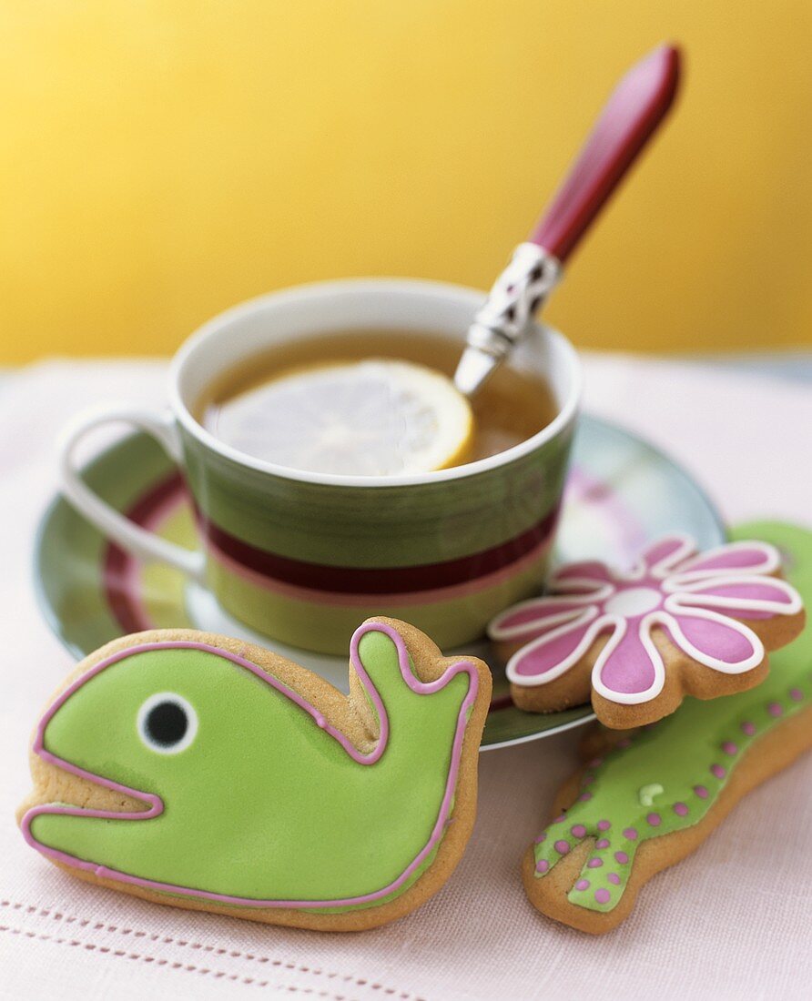 Animal-shaped biscuits with tea