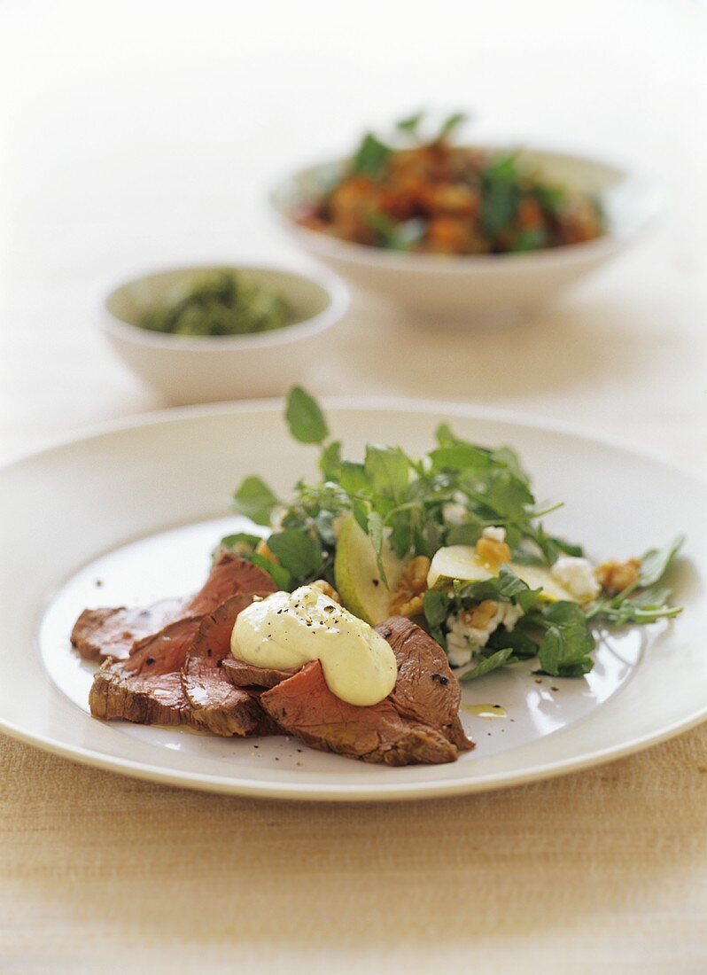 Pieces of roast beef with autumn herb salad