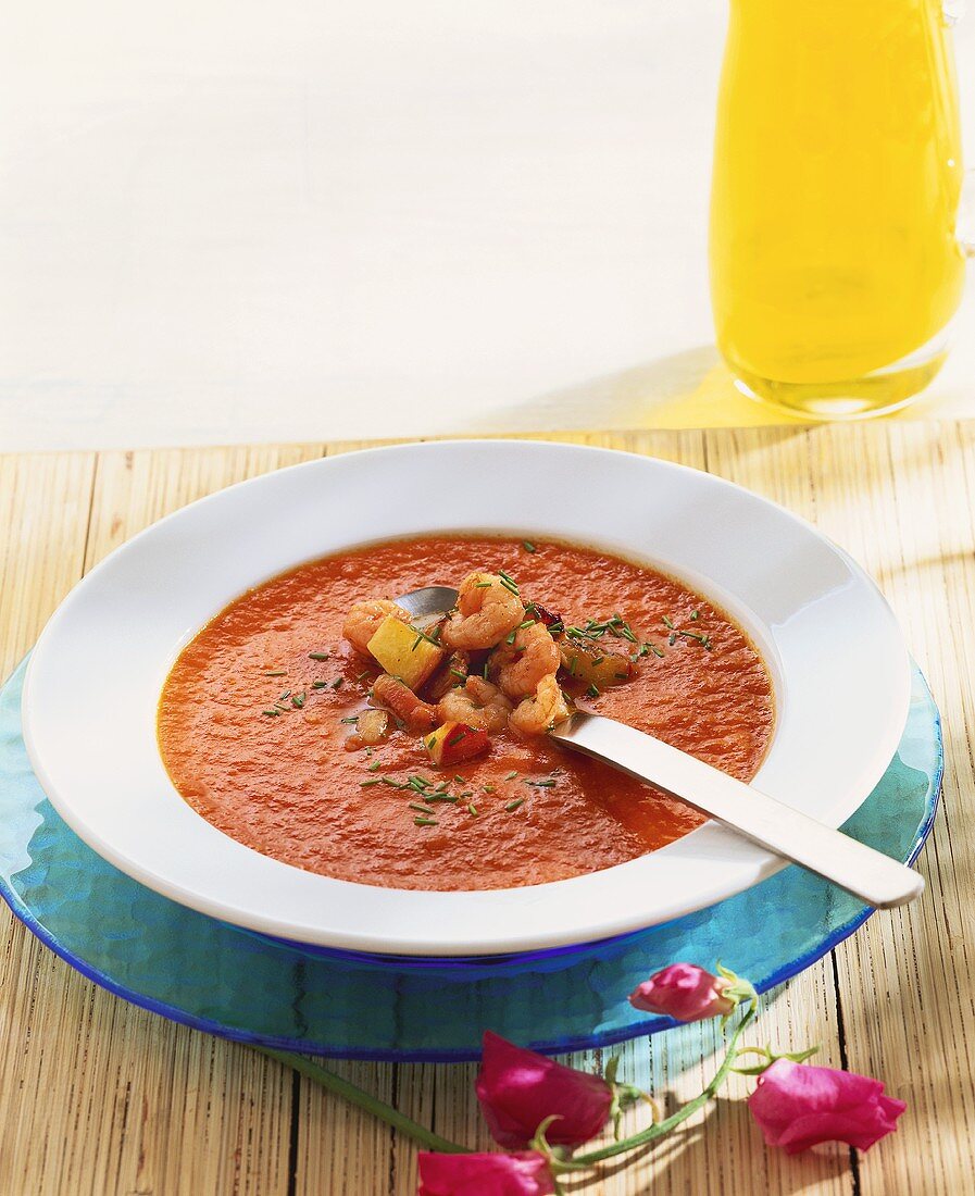 Creamed tomato soup with shrimps and peach