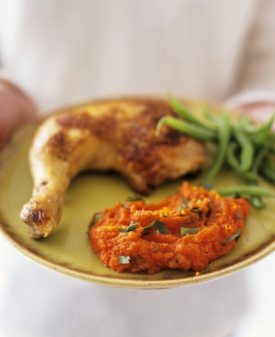 Chicken leg with green beans and carrot puree