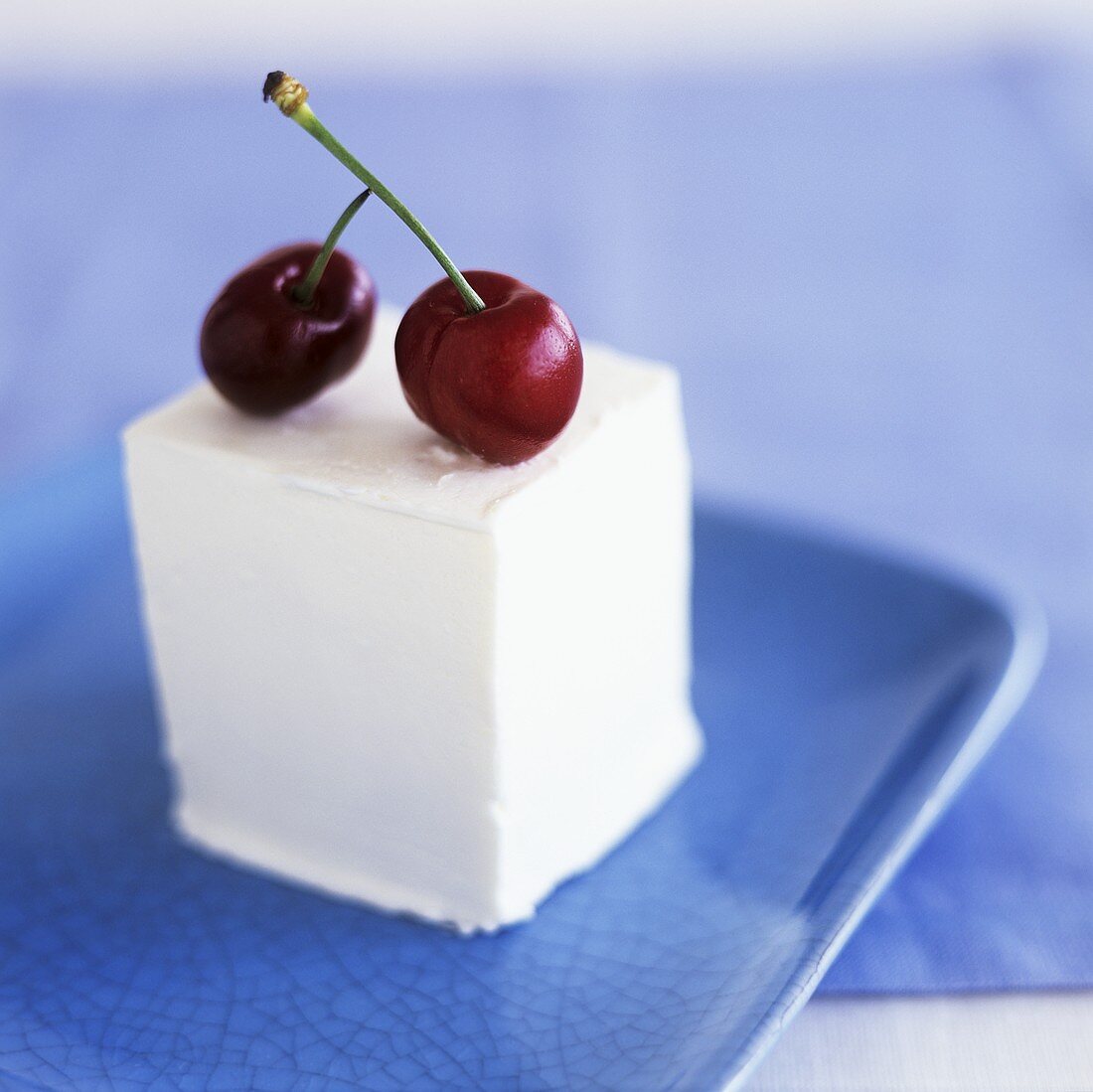 Set yoghurt dessert with two cherries