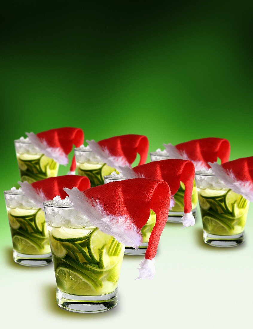 Christmas cocktail with slices of lime and crushed ice