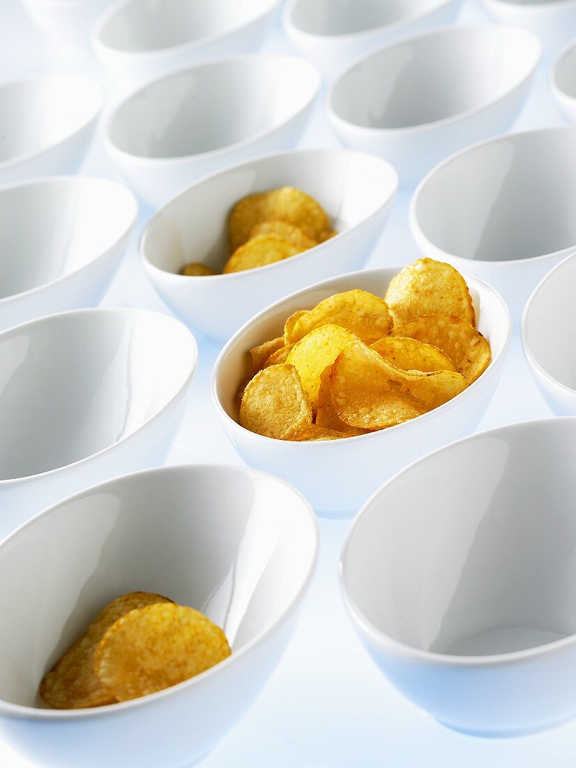 Lots of bowls, some filled with crisps