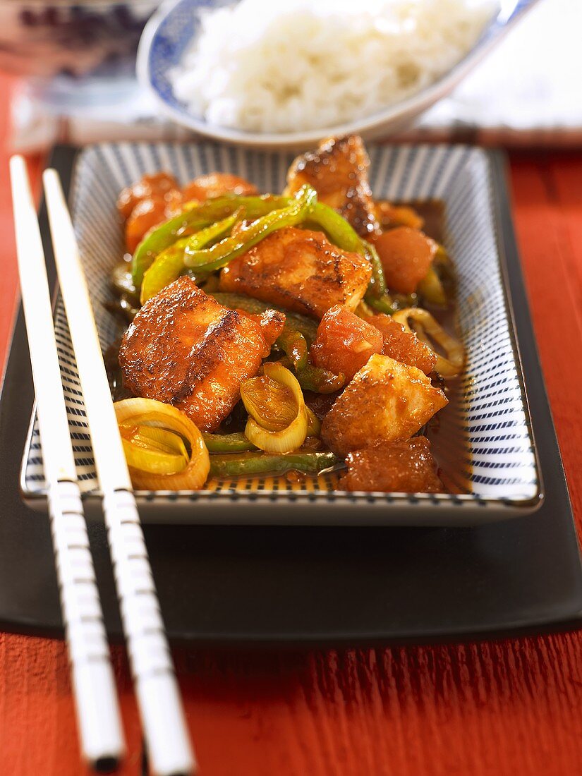 Chinese fish dish with leeks and tomato sauce