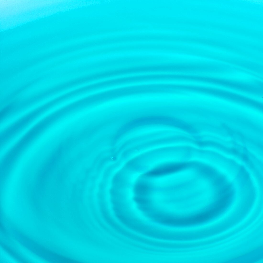 Surface of water with circular ripples