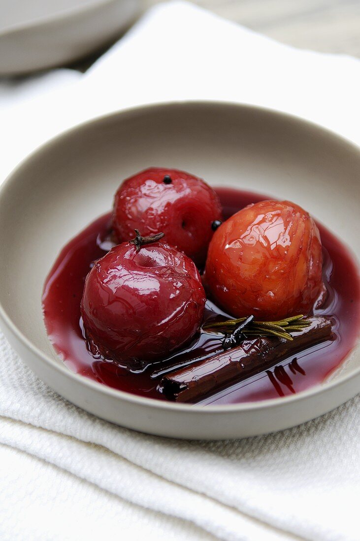 Poached plums in rosemary syrup