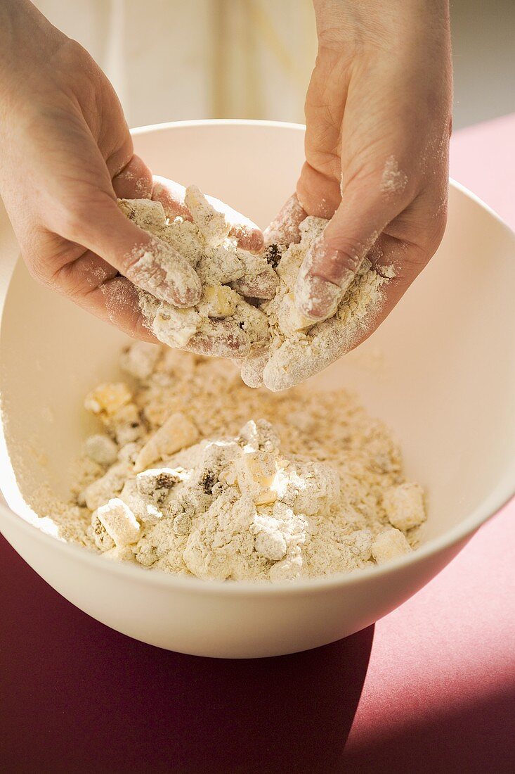 Mixing crumble ingredients in a bowl