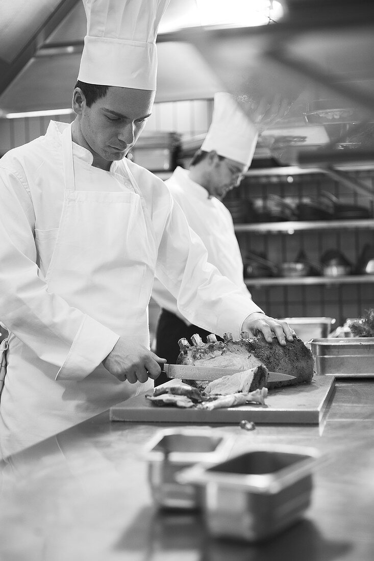 Chef carving a roast