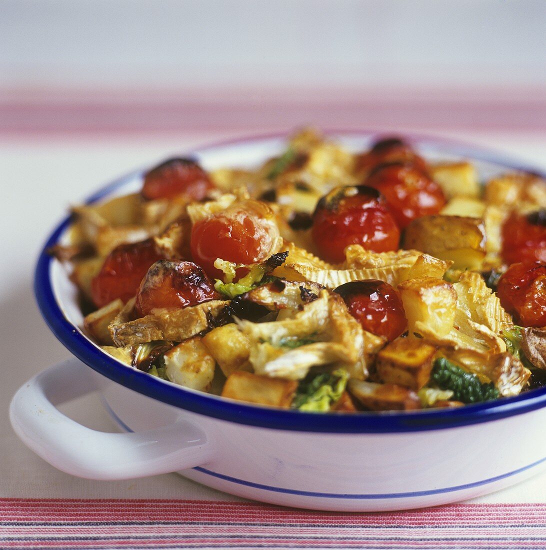 Baked cocktail tomatoes, potatoes, savoy and Camembert