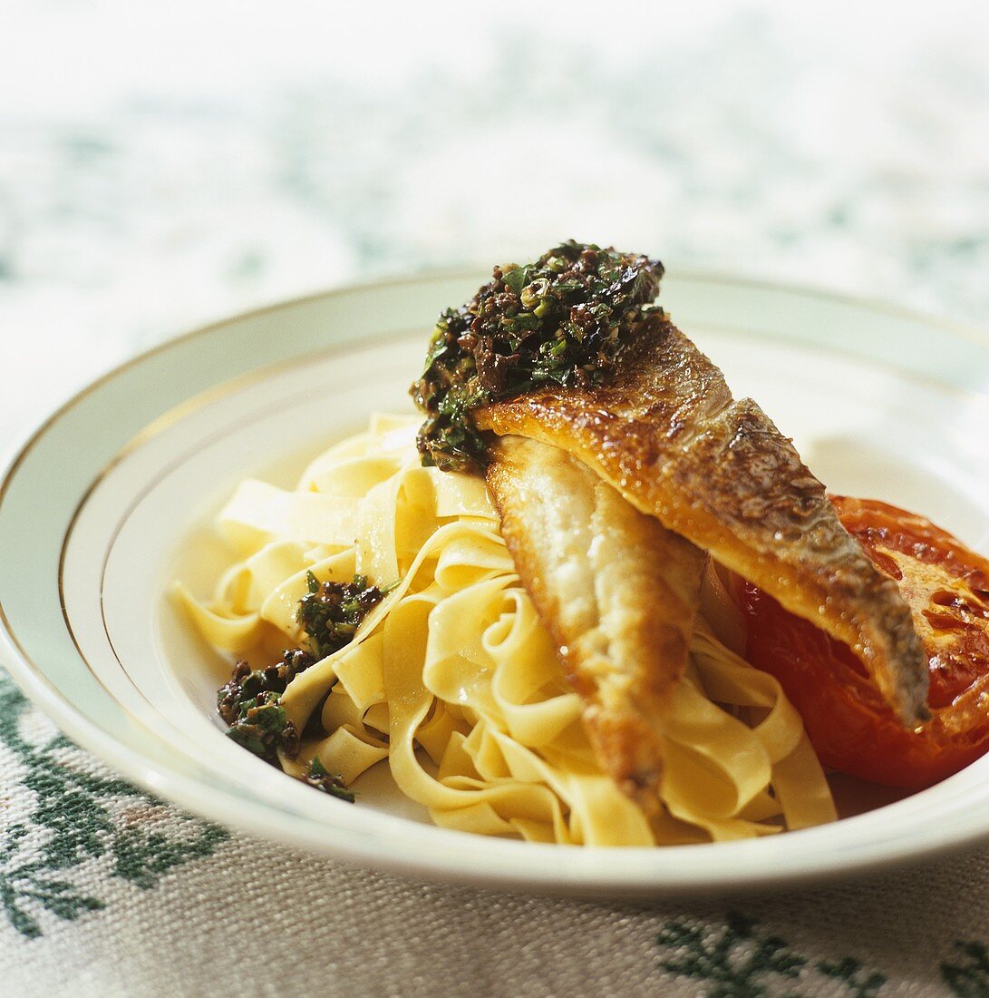 Grilled fish fillet with salsa verde, tomato & ribbon pasta