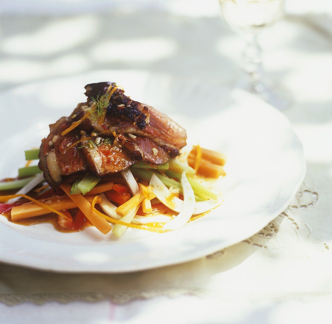 Duck breast with orange zest on vegetables