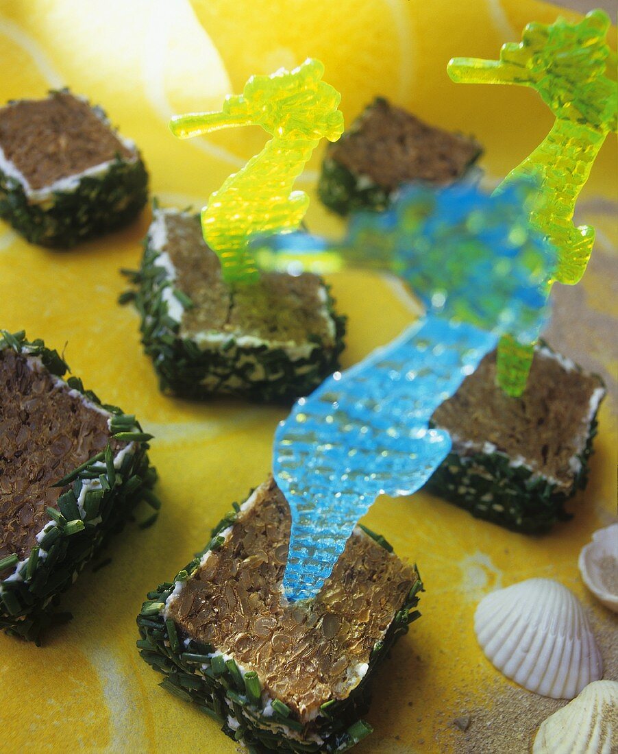 Several soft cheese appetisers with chives