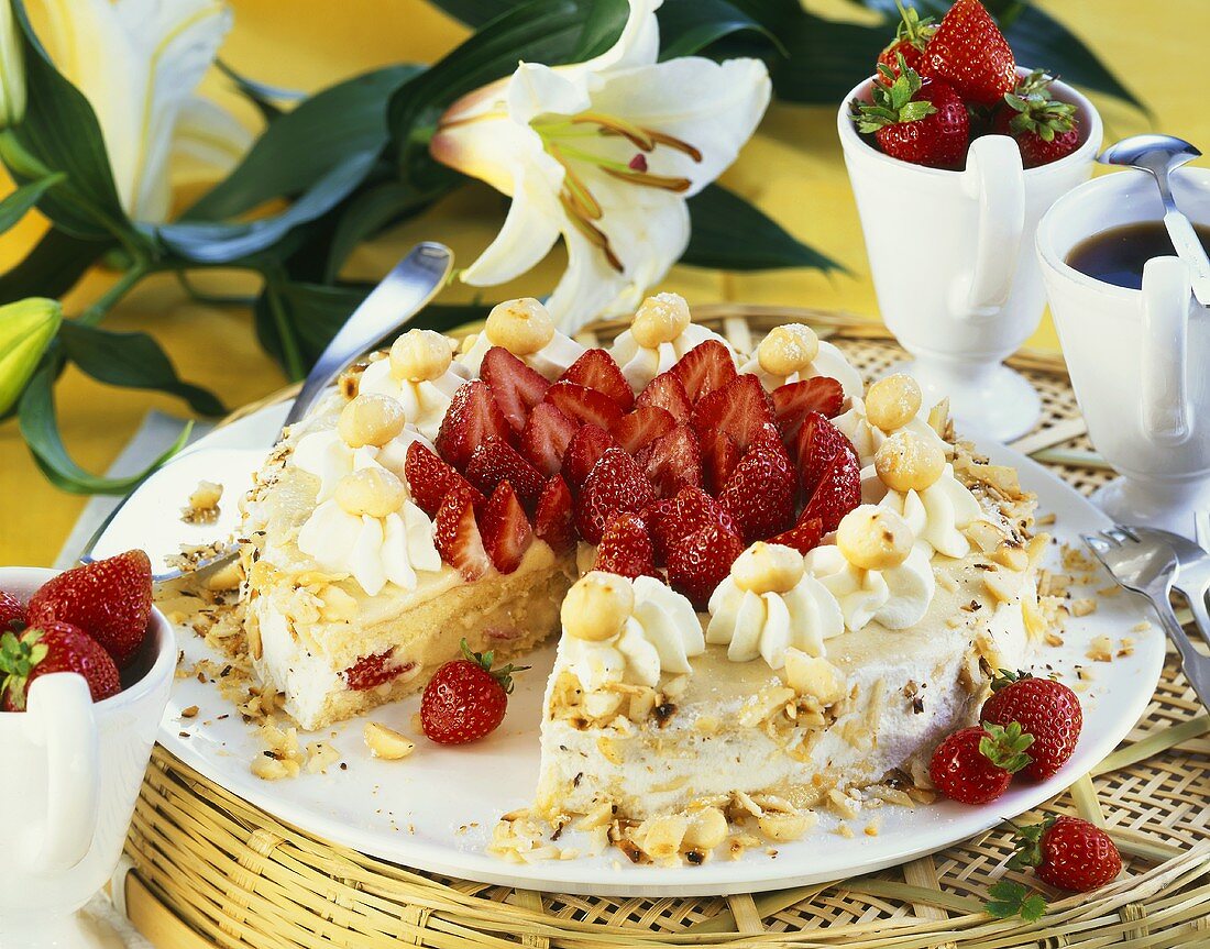 Buttercream cake with strawberries and macadamia nuts