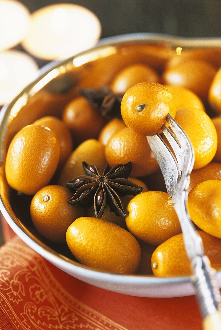 Kumquats and star anise in a bowl