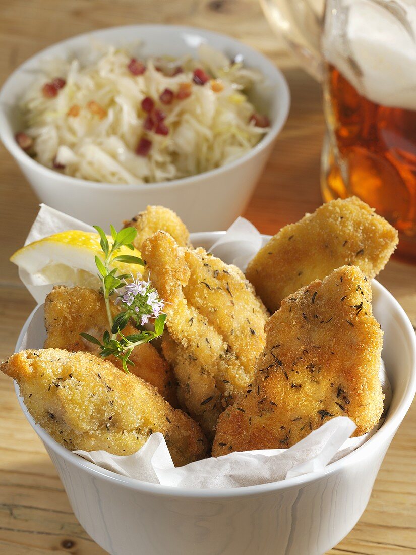 Breaded chicken breast pieces with cabbage salad