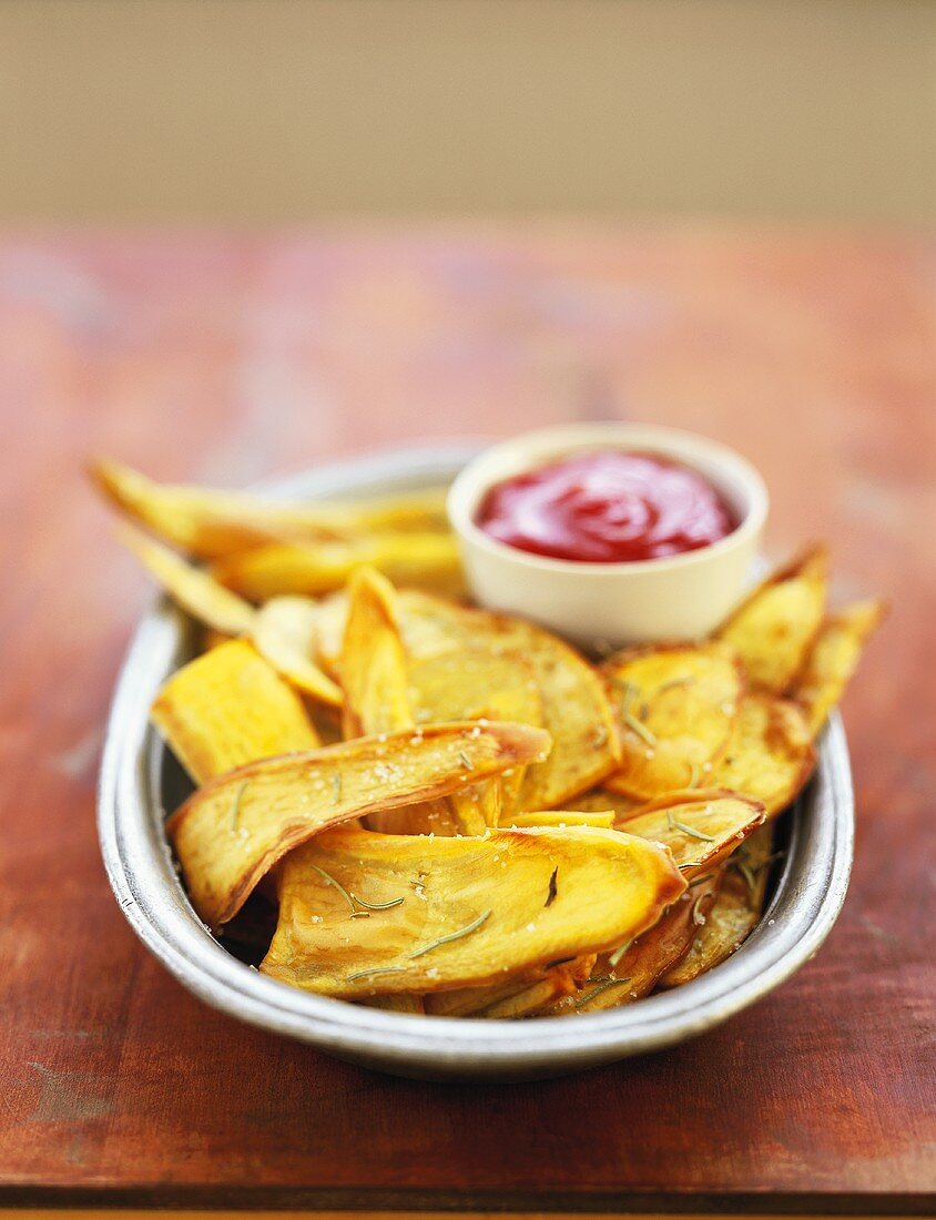 Deep-fried sweet potato slices with ketchup