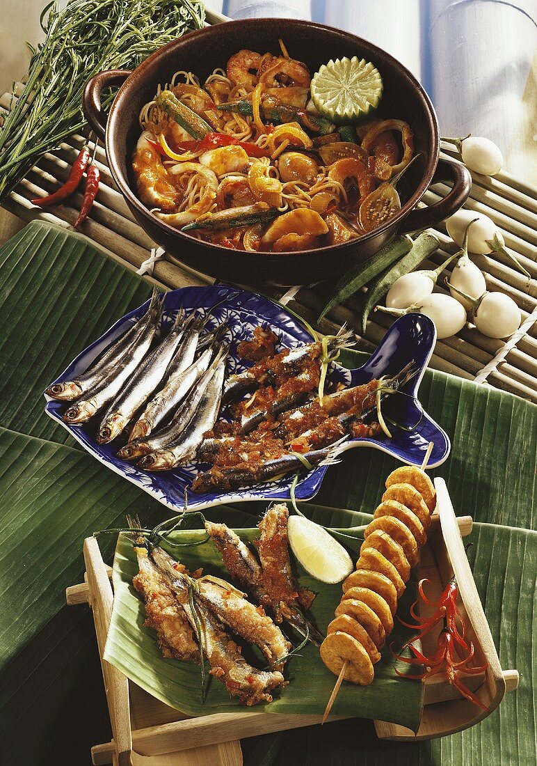 Sour noodle & fish stew &fried anchovies with banana kebab