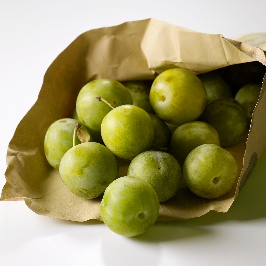 Greengages in a paper bag