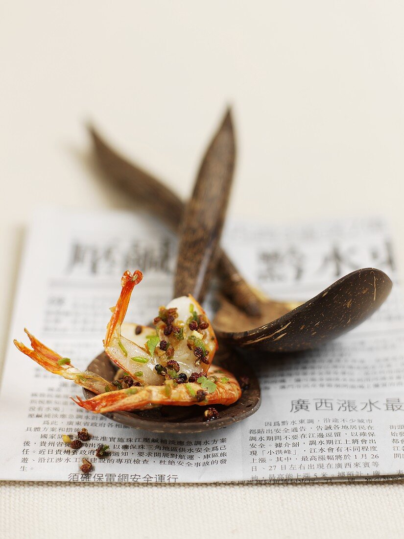 Peppered shrimp on a wooden spoon