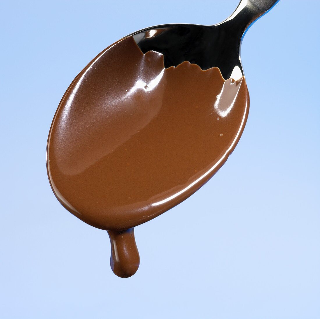 Chocolate dripping from a spoon
