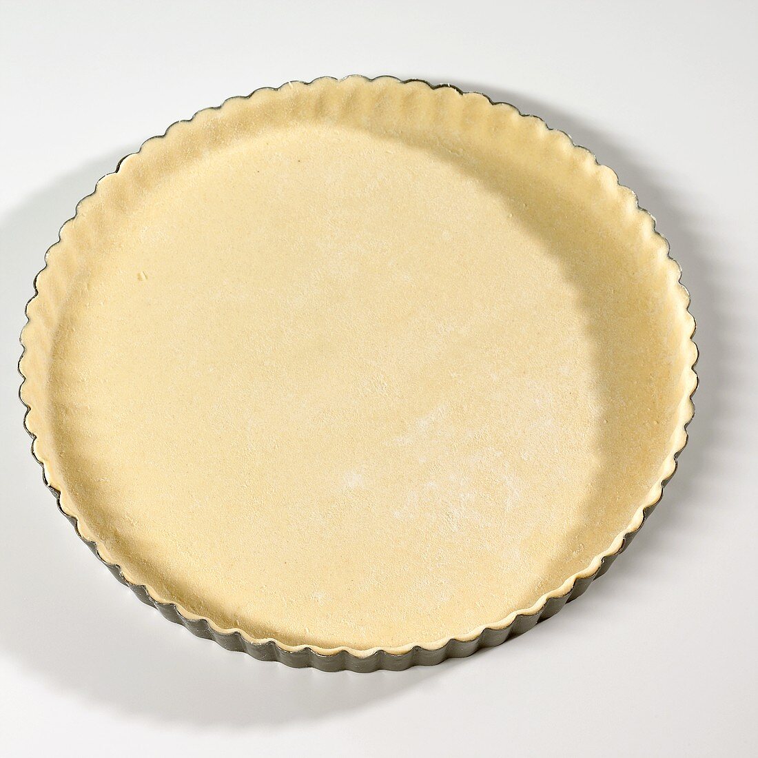 Tart tin lined with pastry